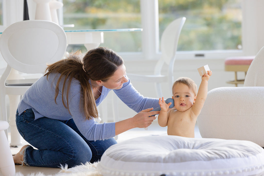 How baby massage can increase the bond with baby. Bonding with baby through baby massage can ease post partum depression and anxiety.